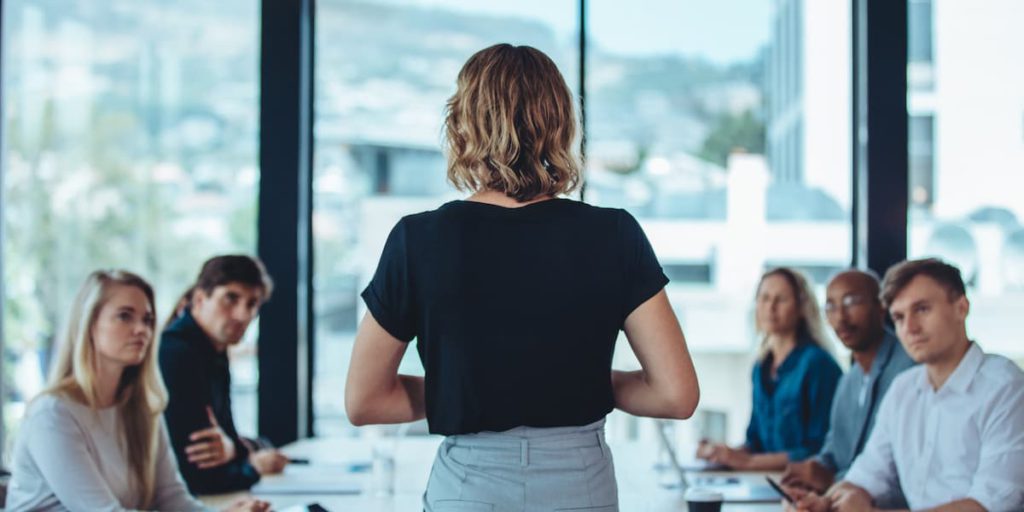 female tech CEO talks to her team about women in tech