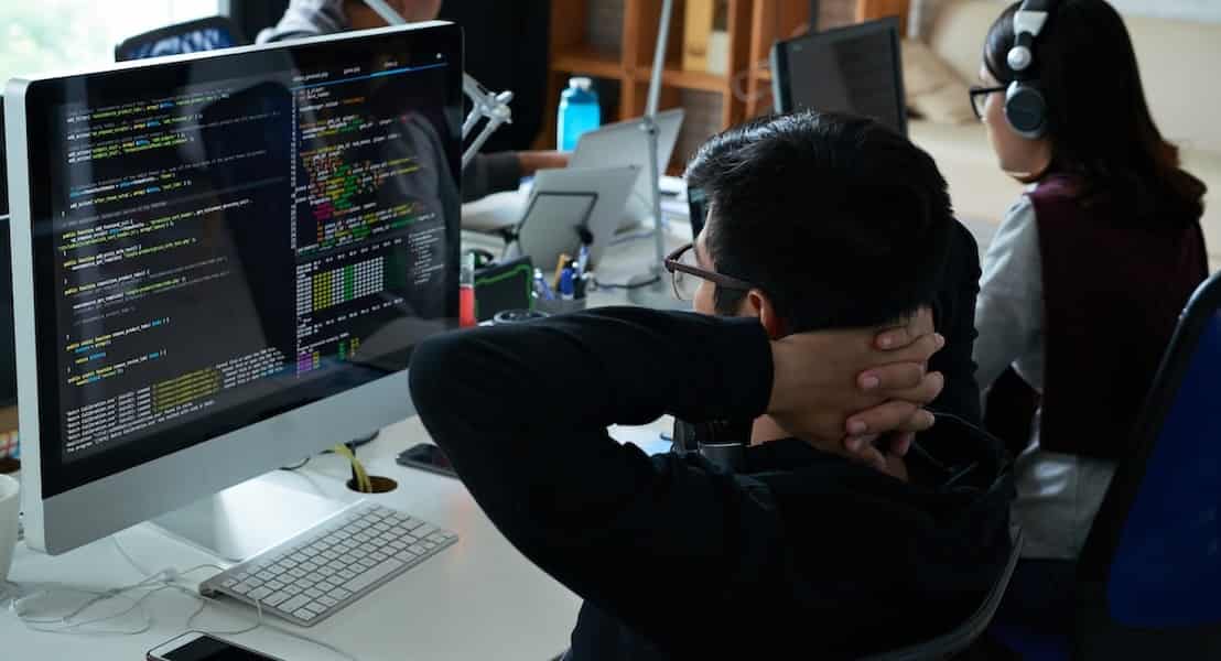 A backend developer reviewing on code quality.