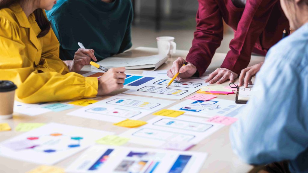 ui designers participating in ui design at a shared desk