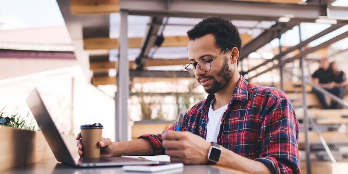 Man taking a social media course online from a coworking space