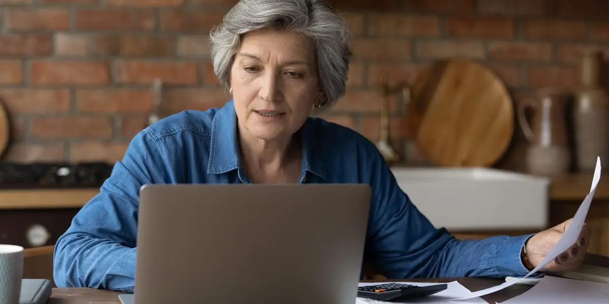 A data analyst looking at a screen, figuring out how to use the COUNTIFS function in Excel