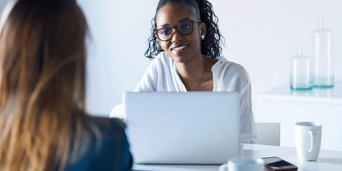 Regression vs classification: Two data analysts sitting at a desk