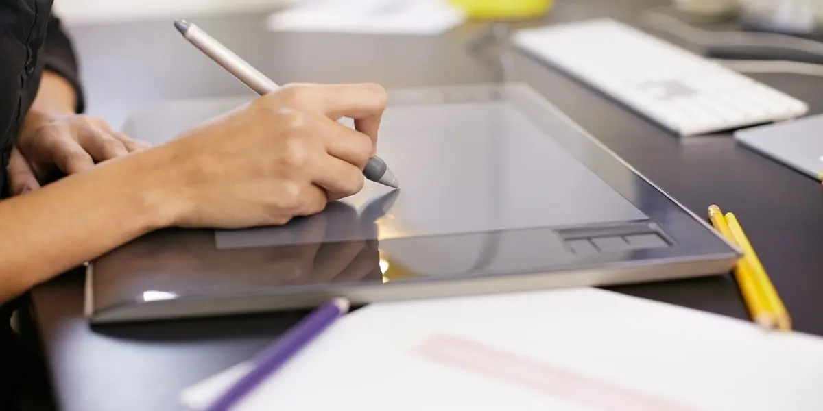 A UI designer sketching on a tablet