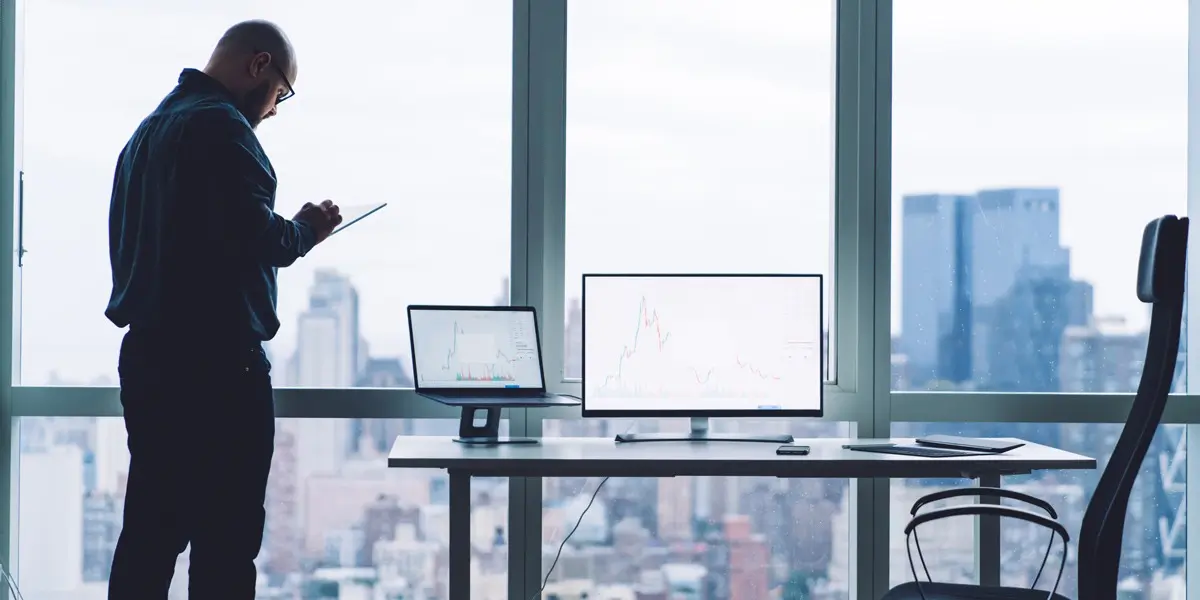 A data analyst standing in a modern office