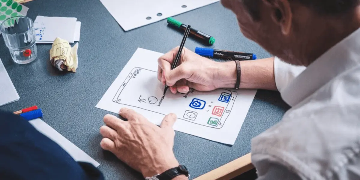 A designer sketching out a wireframe