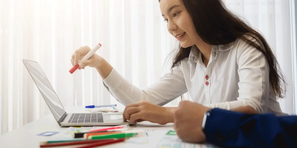 A UX designer sitting at a desk, reviewing user testing results