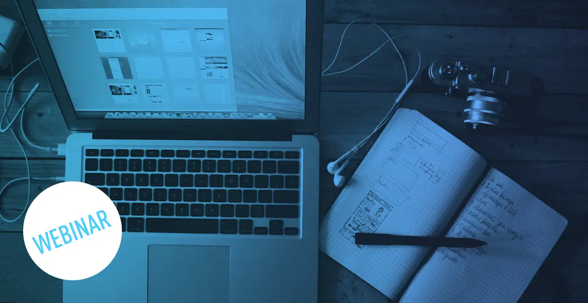 An open laptop and notebook on a table (blue saturated image) with a webinar label overlayed