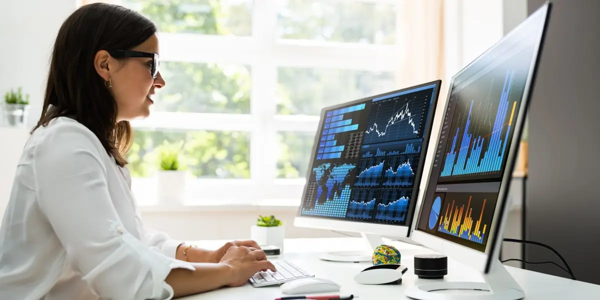 A data analyst in side profile using the xlookup function in Excel