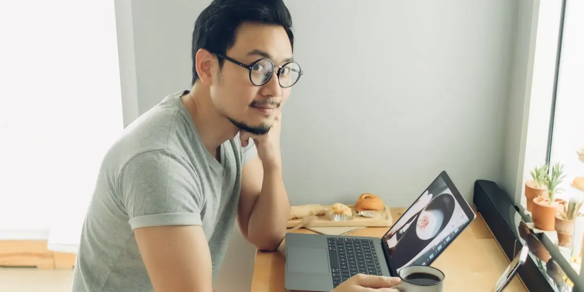 A UI designer working on a laptop, creating a storyboard