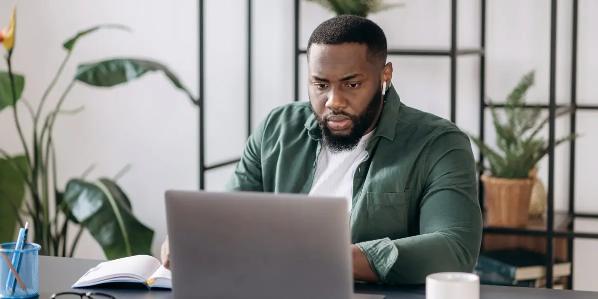 A designer working on a laptop, using a storyboard template