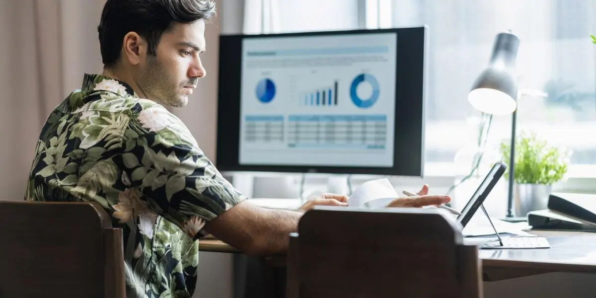 Data analyst working on a laptop using Tableau