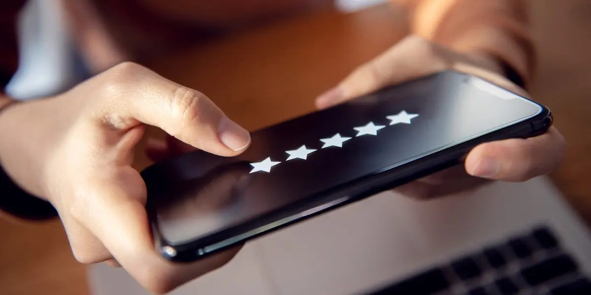 Person makes a rating on their phone, which gets used for sentiment analysis purposes