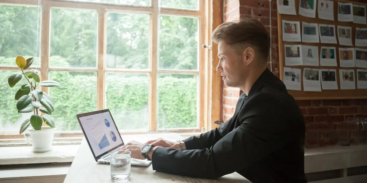 Operations analyst working near a window