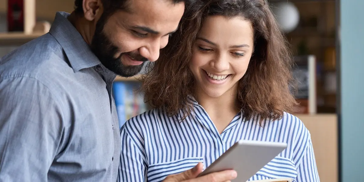 Colleagues looking at payscales for a marketing consultant salary