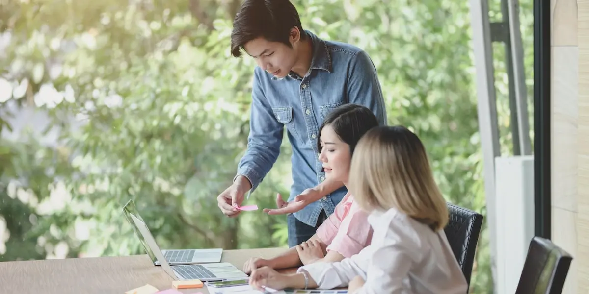 Colleagues using free SEO tools in their office