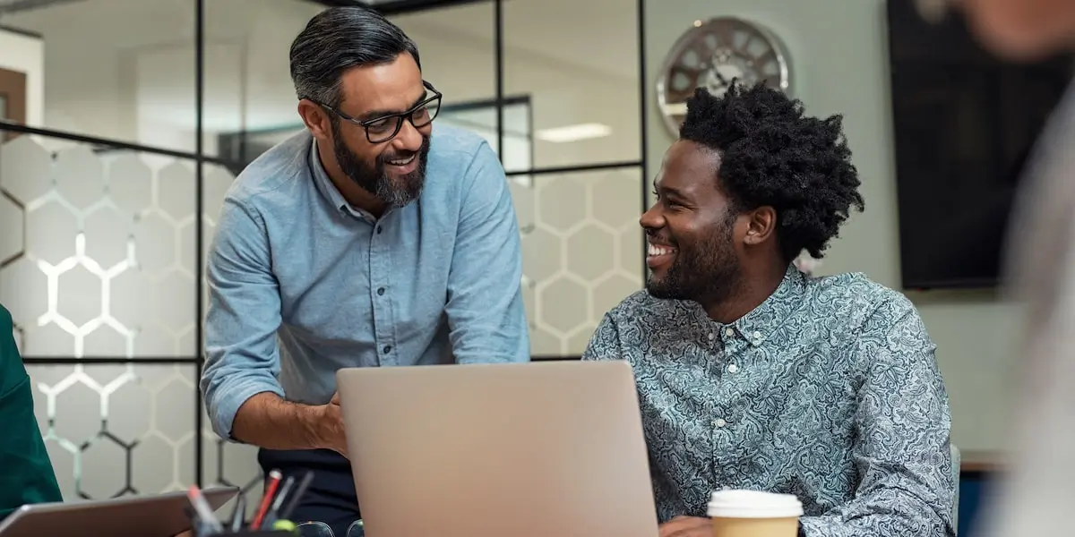 A developer discussing his tech stack with his coding mentor.