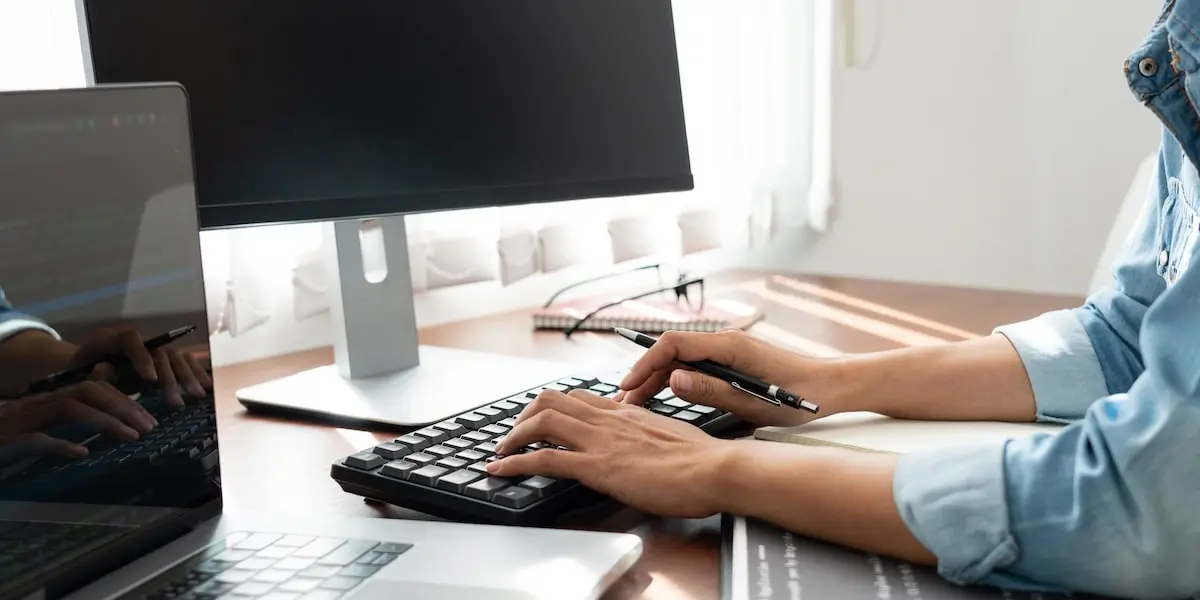 Data analyst working on spatial analysis models on their computer