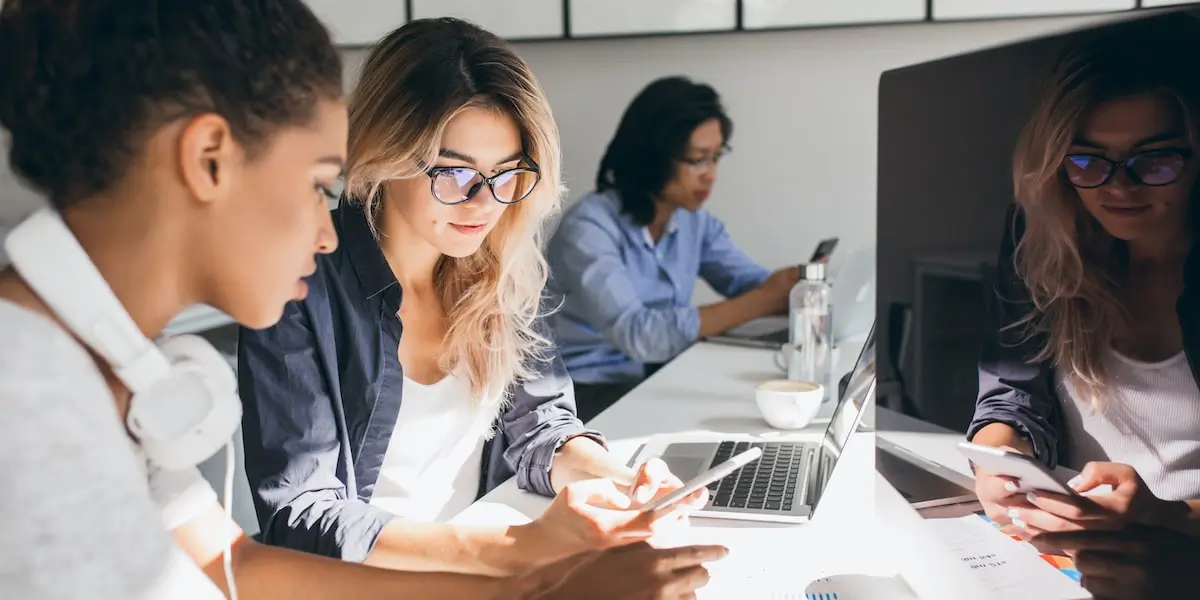 Colleagues looking at different digital marketing job titles on the market