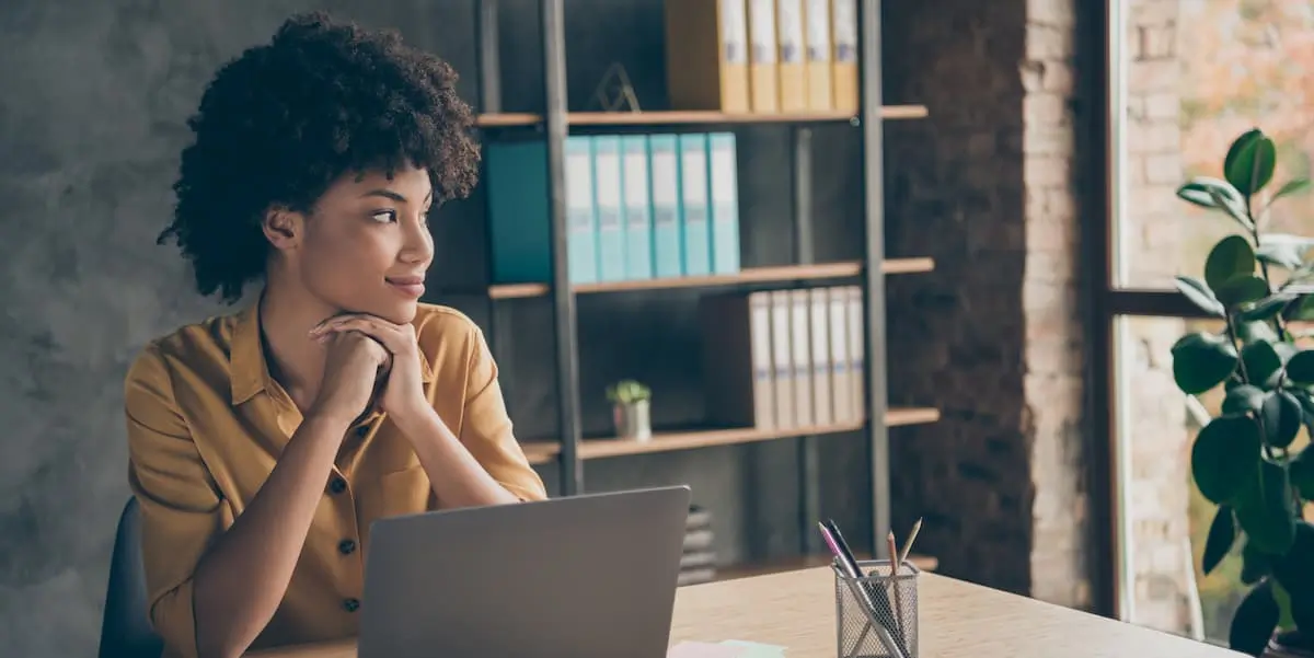 young freelancer looks out of window while thinking about the future of work