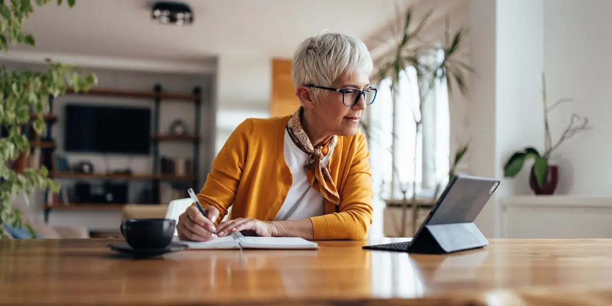 Jobseeker looks up a marketing consultant job description on their tablet