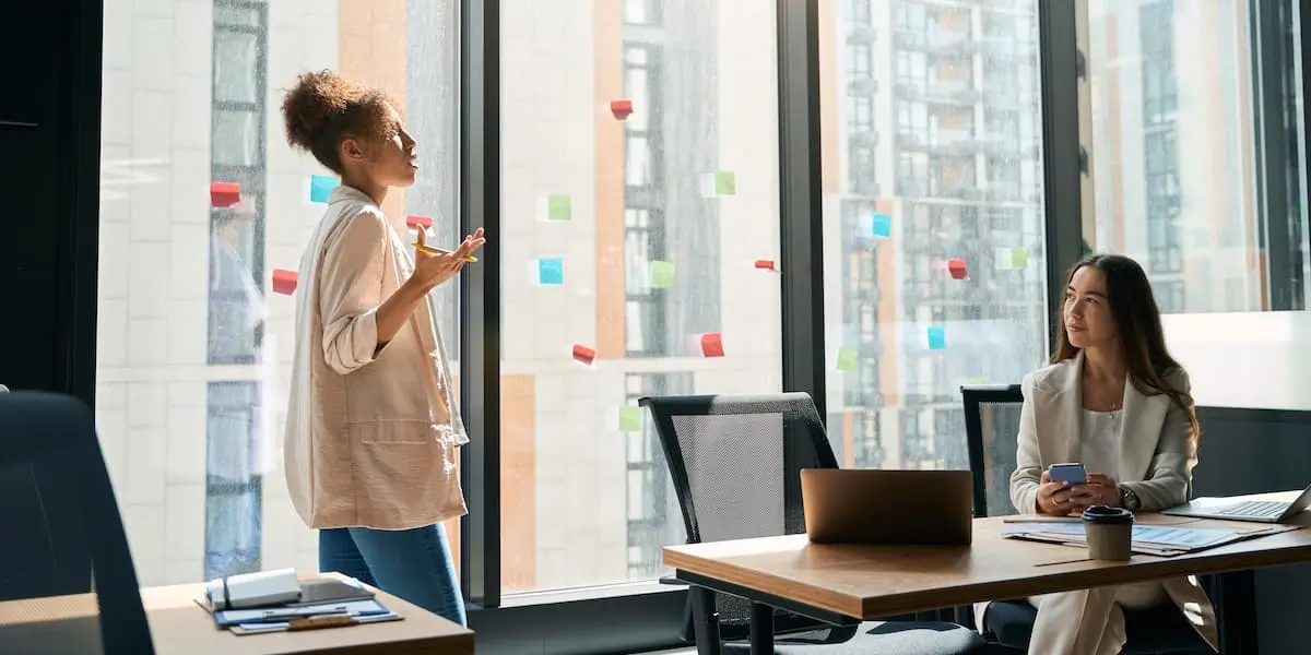 A woman earning a product manager salary in NYC makes a presentation.