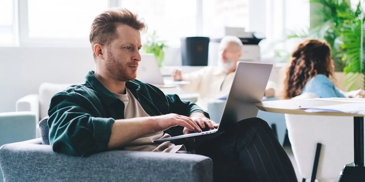 An ML engineer sits on his laptop using Python machine learning libraries .