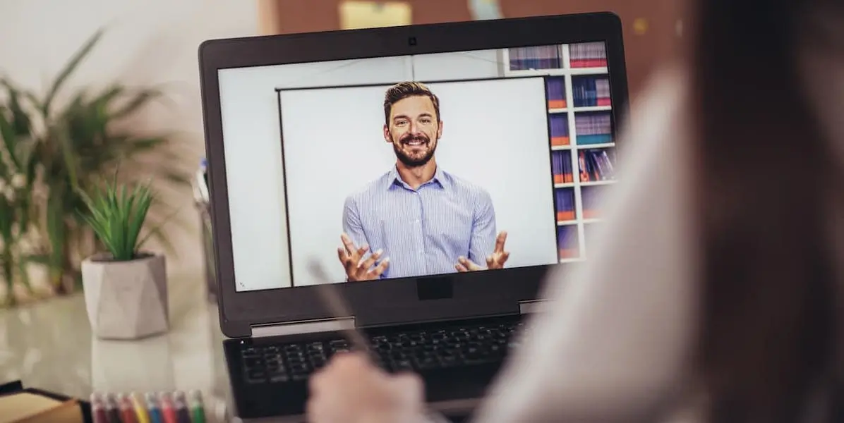 A learner takes notes from a class on one of the best online learning platforms.