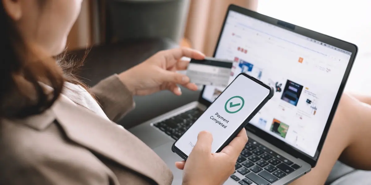 A woman uses her credit card to successfully make a payment. This is one of many product design examples of clear, useful product design.